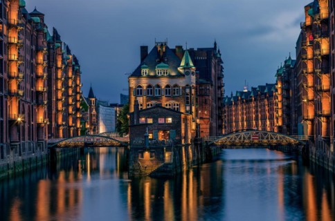 View of the Speicherstadt at night in Hamburg, Germany. Illuminated Speicherstadt seen from the