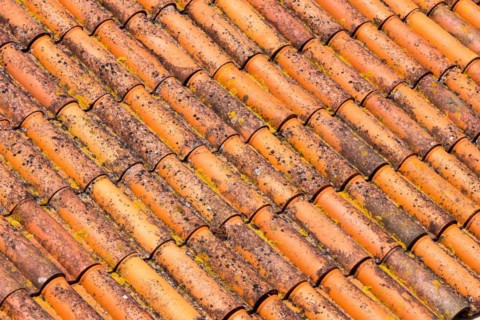 Background of old and dirty red roof tiles
