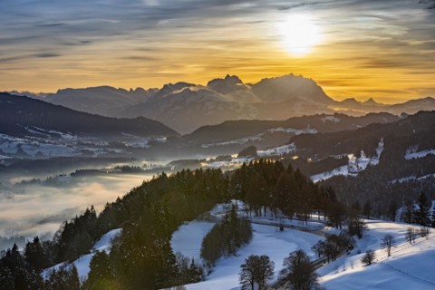Dreamlike winter landscape at sunset with a view from the Allgäu Alps over the Bregenzerwald in