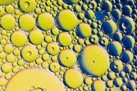 Colorful abstract macro background with oil drops in water