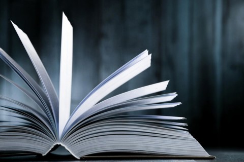 Composition with hardcover book on the table