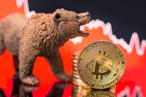 Bitcoin with a red chart drop. Price crash and bear market trend concept