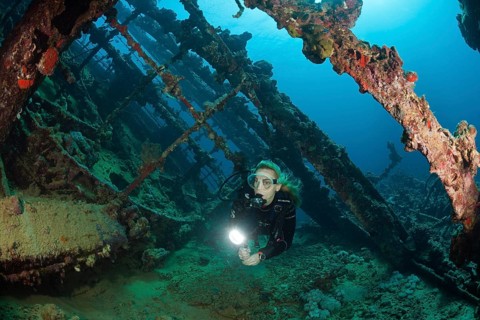 Divers on the wreck of the Umbria, Wingate Reef, Red Sea, Sudan, Africa