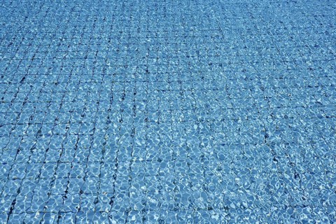 Blue tiles pool water waves perspective summer background
