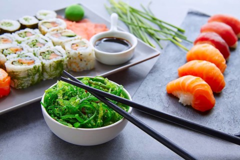 Enjoy sushi maki and nigiri served with wasabi and seaweed salad