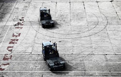 Loading lorry tractors in the port of Newcastle after work in the car park in front of the ferry