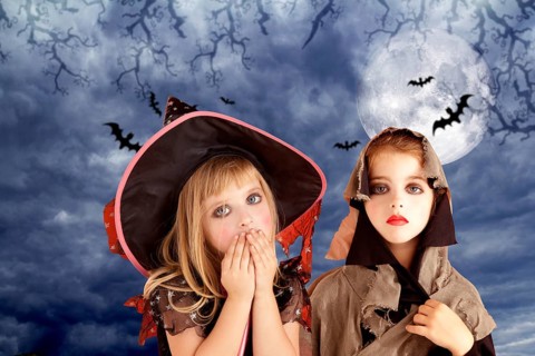 Halloween costumes kid girls on moon night sky with bats