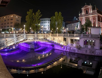 Famous three bridges at the Preseren square in the center of Ljubljana colorfully illuminated at