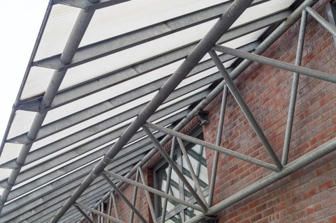 Large metal canopy with supports from below
