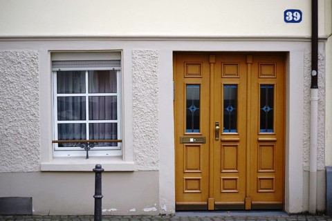 The entrance to an old town flat with very low ceilings and a window