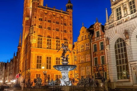 Fountain of Neptune in Gdansk illuminated in evening, Poland, Europe