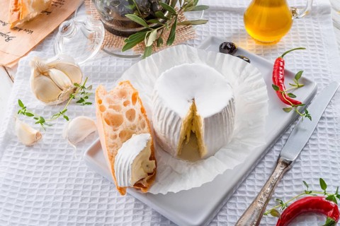 Soft cheese with spicy olives