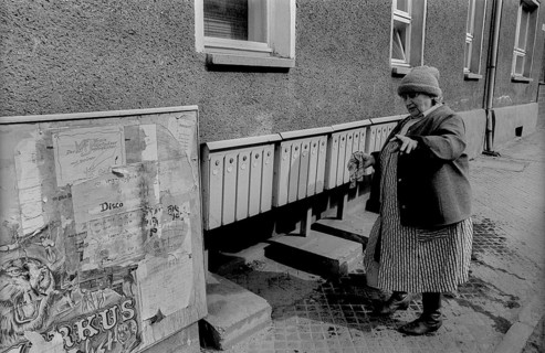 Germany, Wolfen, 31.03.1992, Street, Woman cleaning lockers, Europe