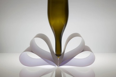 Symmetry abstract - Paper Background with wine glass on a glass table