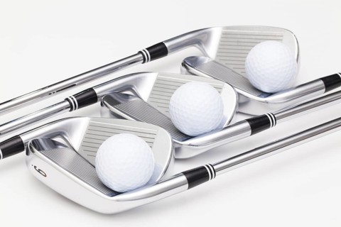 Titanium golf clubs on the white background