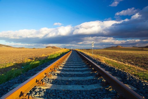 Single railway track at sunset, Central Bohemian Uplands, Czech Republic. Railway track in nature