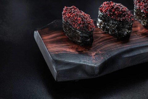 Close Up View Gunkan Maki Sushi On Dark Wooden Board