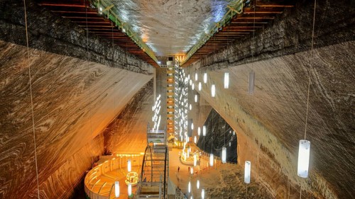 A look inside the historic Salina Turda salt mine with lights in Romania