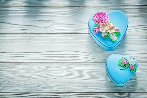 Wrapped gift boxes on wooden board holidays concept