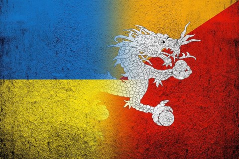 Kingdom of Bhutan National flag with National flag of Ukraine. Grunge background