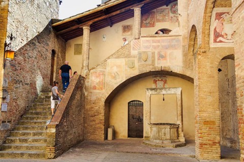 Tourists visit the Museo Civico, San Gimignano, Tuscany, Italy, Europe