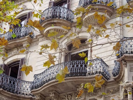 Beautifully shaped balconies on the modernist facade of a residential building, Barcelona,