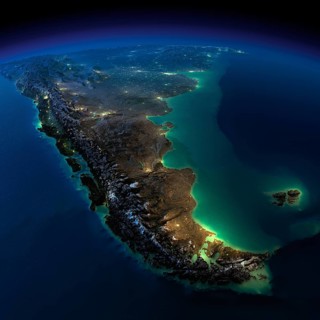 Highly detailed Earth, illuminated by moonlight. The glow of cities sheds light on the detailed