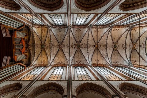 Lubeck, Germany, August 3, 2019: Directly below view of the vaults of St. Mary Church in Lubeck,