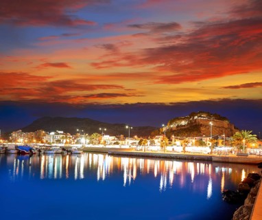 Denia sunset with castle and marina at Alicante in Spain