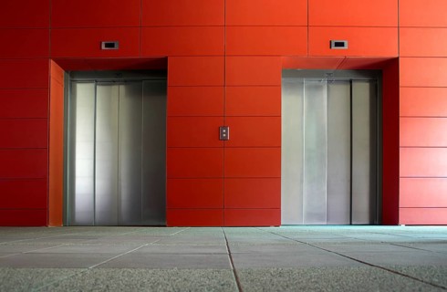 Two elevator doors in a luxurious building