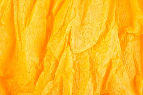 Background of orange old crumpled paper