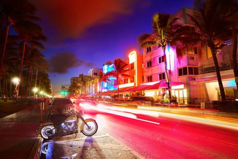 Miami Beach South Beach sunset in Ocean Drive Florida Art Deco and car lights