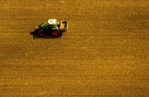 Tractor sowing in a field near Bochum Wattenscheid
