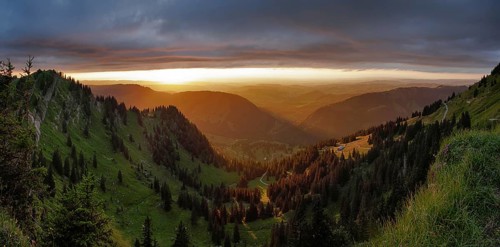 Panoramic view of a light and weather scene over the foothills of the Alps, taken from the