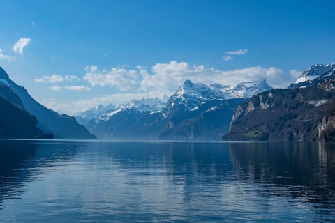 Lake Vierwaldstaettersee, surrounded by snow covered mountains, seen from Brunnen, Switzerland, on