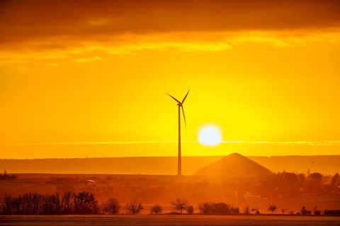 Sunrise with a view of wind turbines and mining heaps from the copper mines in the south of the