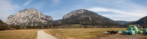 Lamingtal cycle path between farmland in spring, Pribitz mountain and Meßnerin mountain, in the