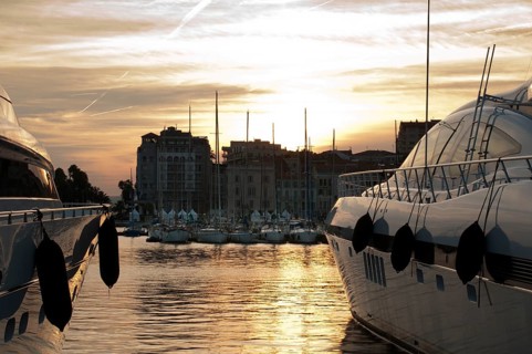 Yachts moored in Cannes at sunset. Cannes bay