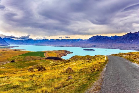 New Zealand, South Island. Lake Tekapo on cloudy day. The lake in the mountains. Travel to a