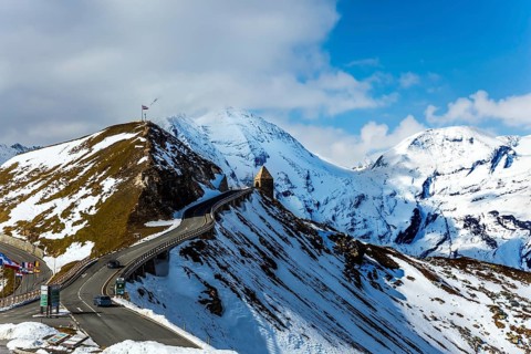 Austrian Alps. The snow on the mountainside began to melt. Dizzy turns of mountain serpentine.