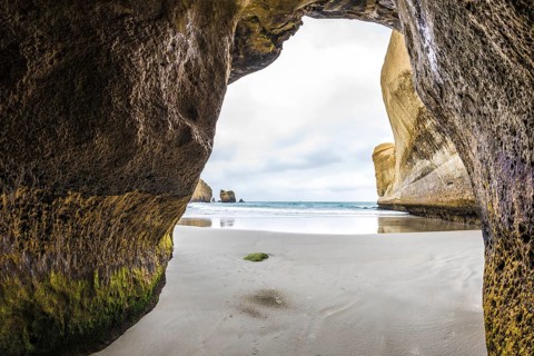 An image of a cave at Tunnel Beach in New Zealand
