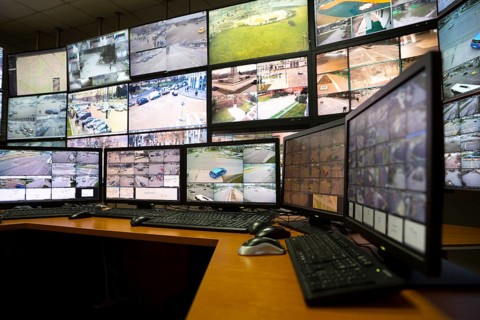 The control room of the city surveillance center. Computer monitors showing the cameras all over