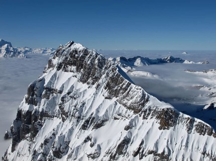 Harsh mountain peak next to the Titlis, sea of fog