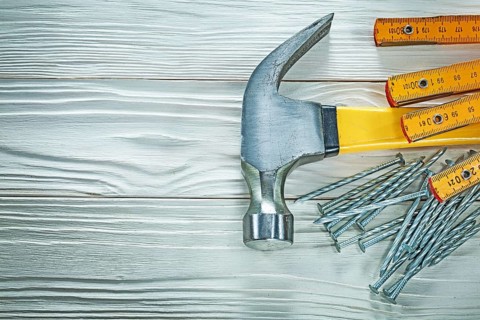 Wooden meter claw hammer stainless nails on wood board