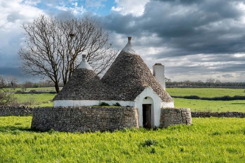 Scenic Trullo dwelling in the rural landscape near Alberobello, Southern Italy