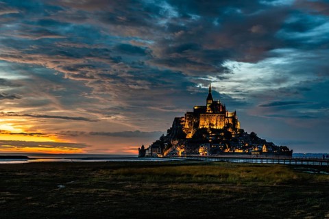 Dramatic sunset on Mont Saint Michel, Normandy, France, Europe