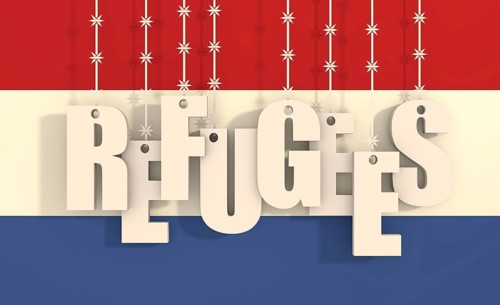 Image relative to migration from africa to european union. Refugees text hanging by barbed wire.
