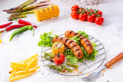 Grilled krakauer sausage with boiled corn and green salad
