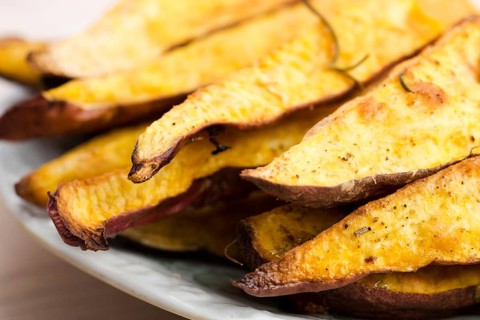 Portion of fresh baked sweet potato wedges, lodz, poland