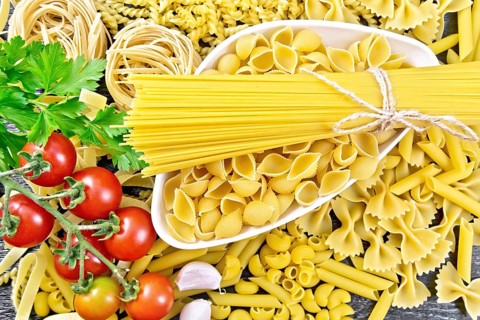 Pasta seashells and spaghetti in bowl, pipe rigate, tagliatelle, fusilli, penne, farfalle,